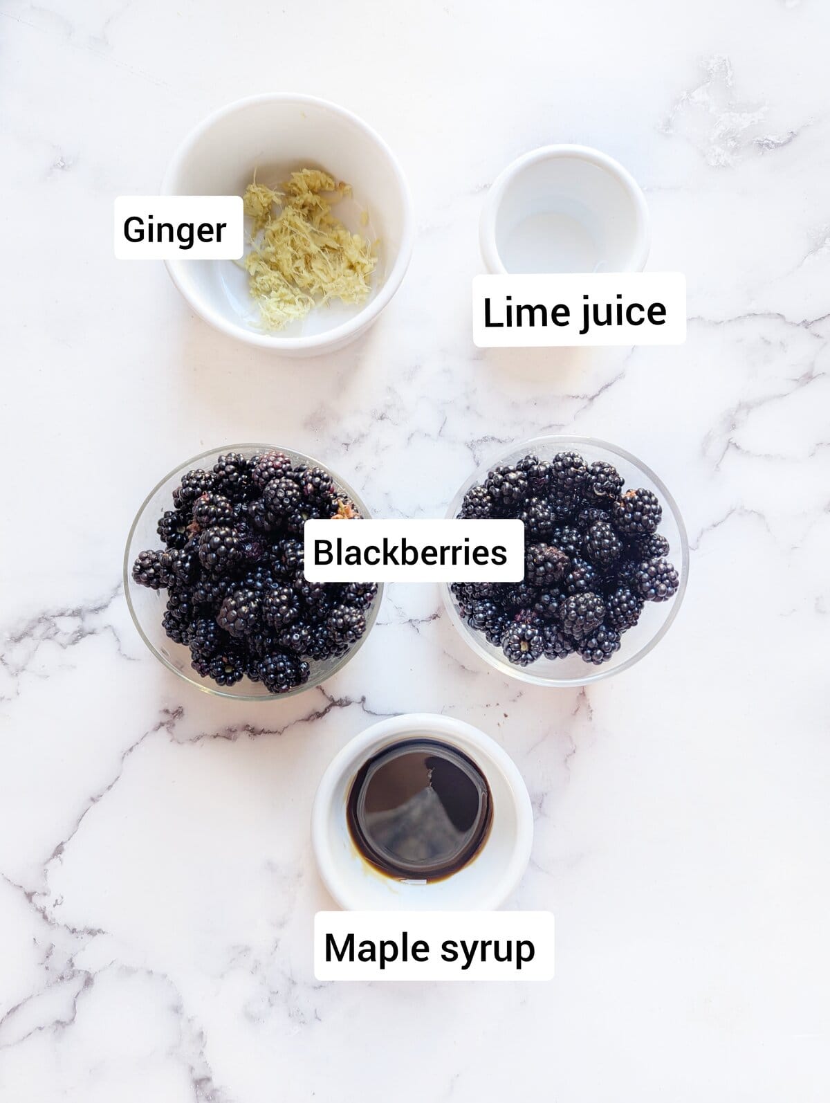 Ingredients for blackberry compte: Grated ginger, fresh blackberries, lime juice and maple syrup.