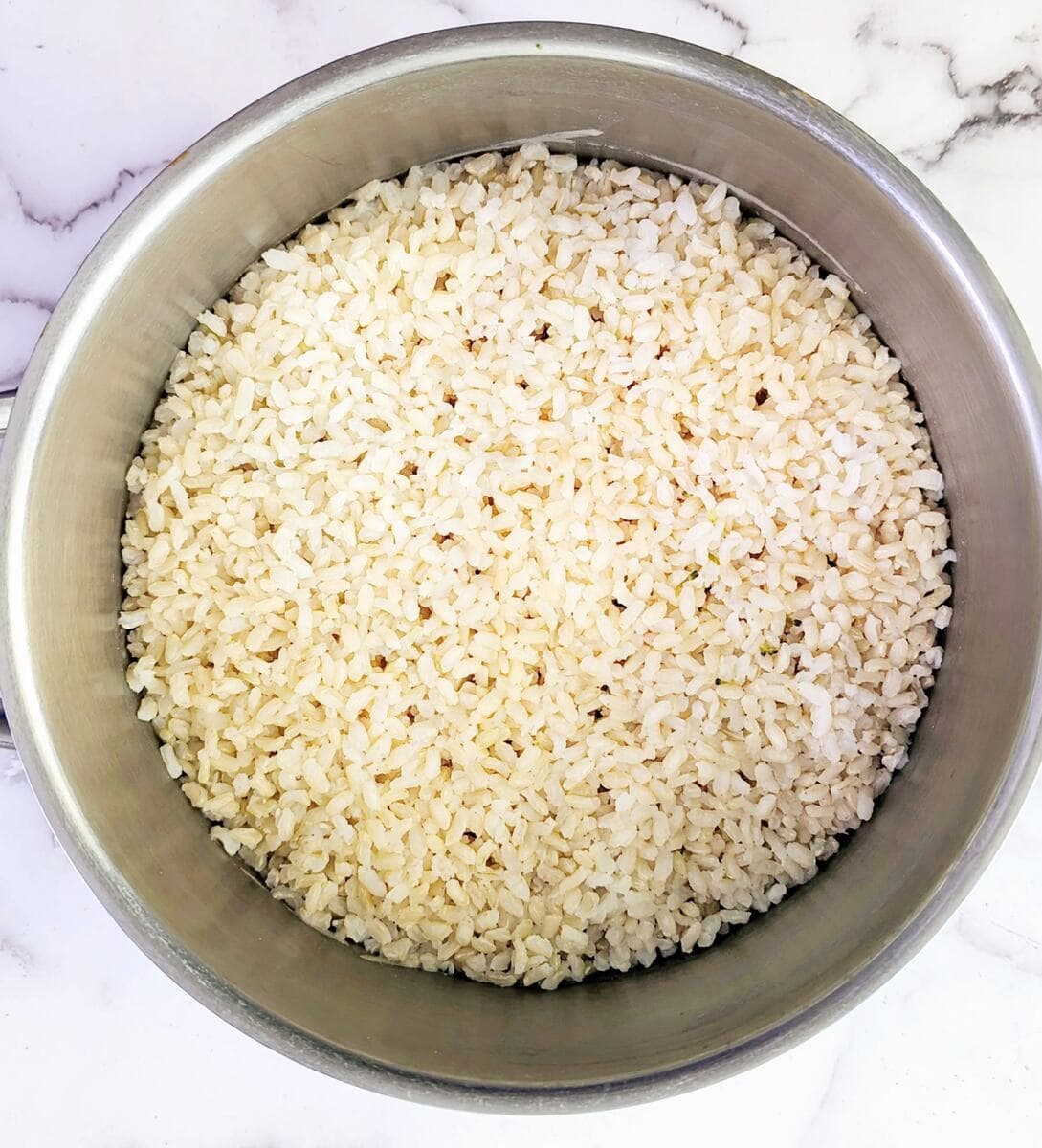 A bowl of cooked brown rice.