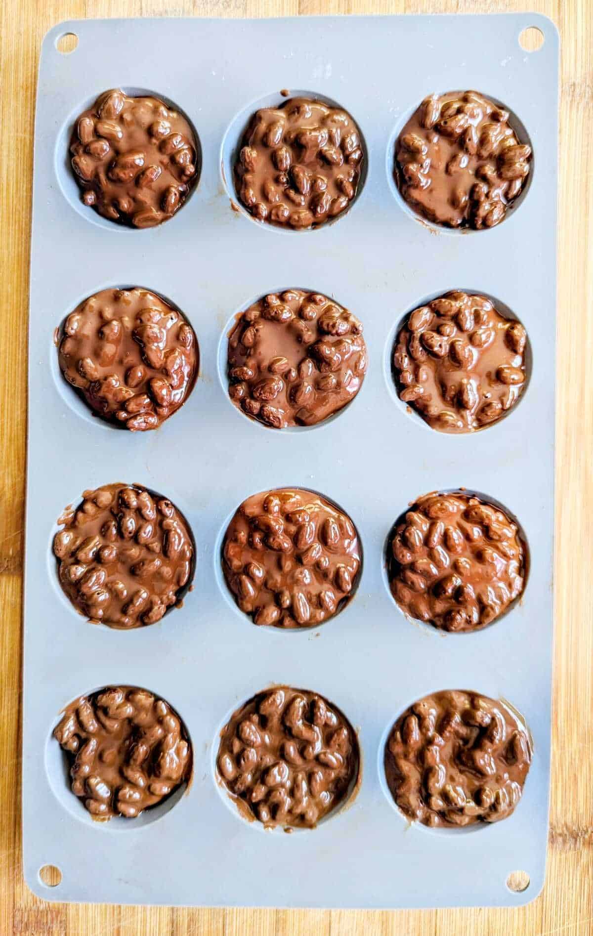 Chocolate puffed rice Easter cups, in a silicon muffin mould ready to be decorated.
