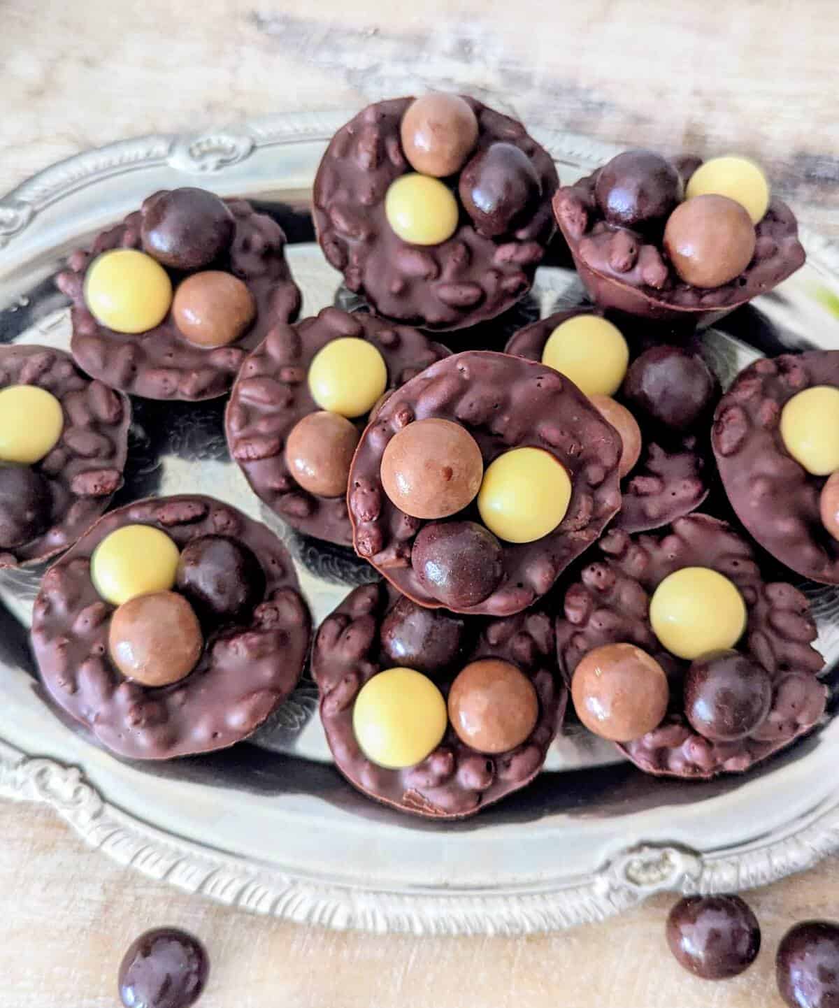 Chocolate puffed rice Easter cups on a silver tray.