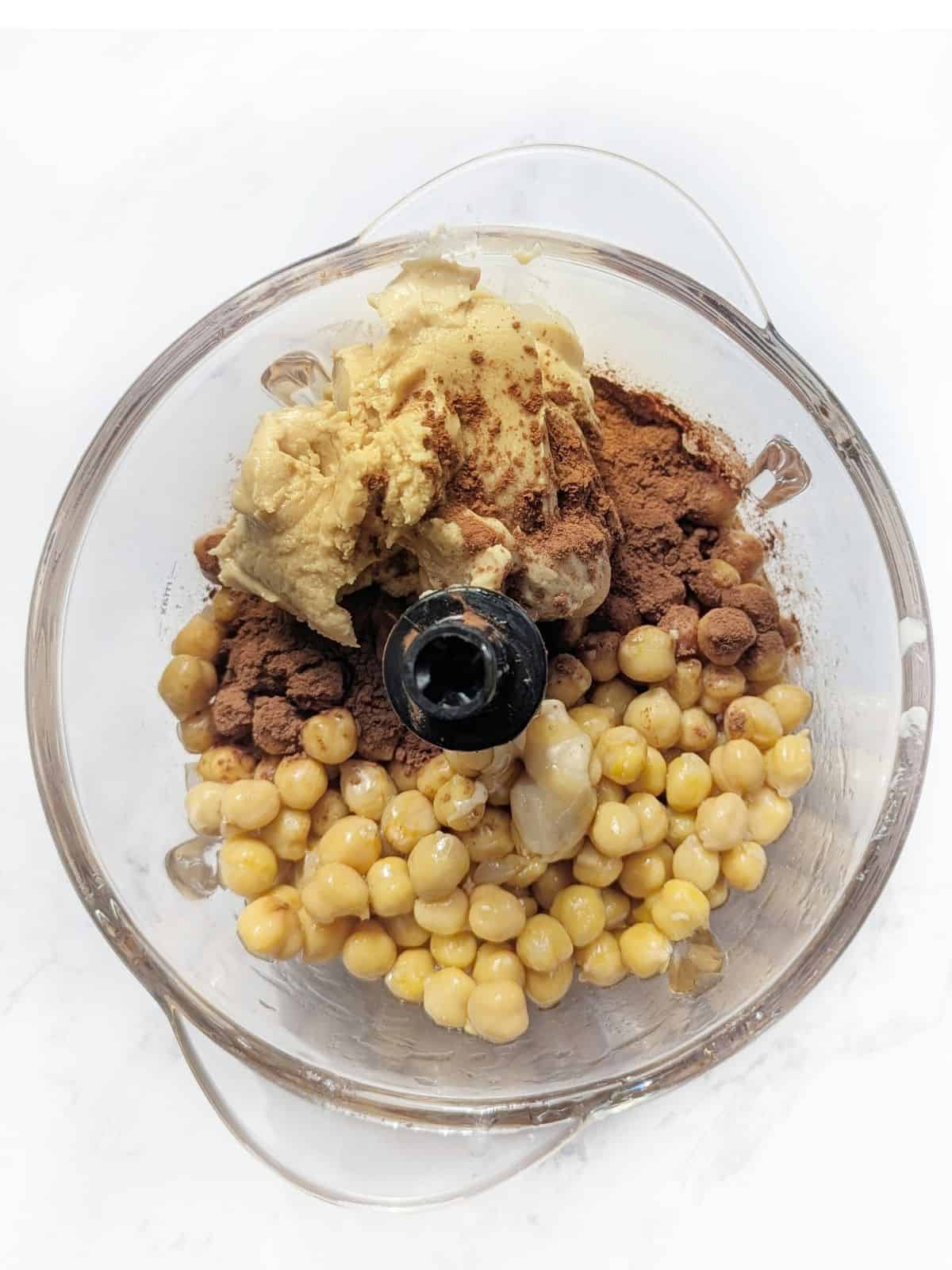 Chickpea cookie ingredients in a blended ready for mixing.