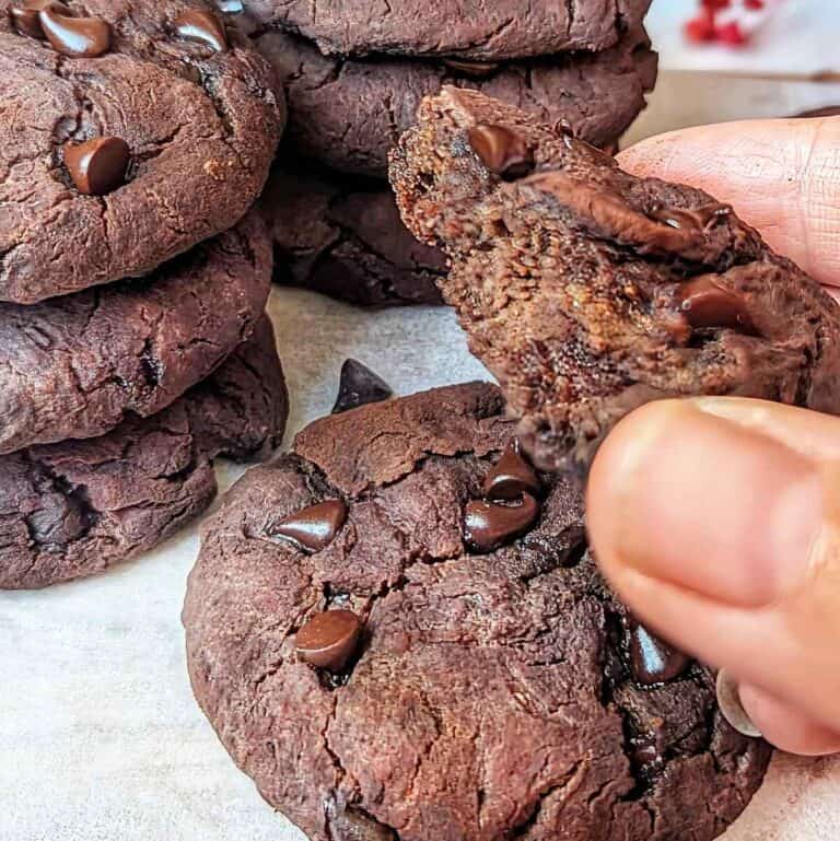 Delicious homemade flourless chocolate cookies with melty chocolate chips.